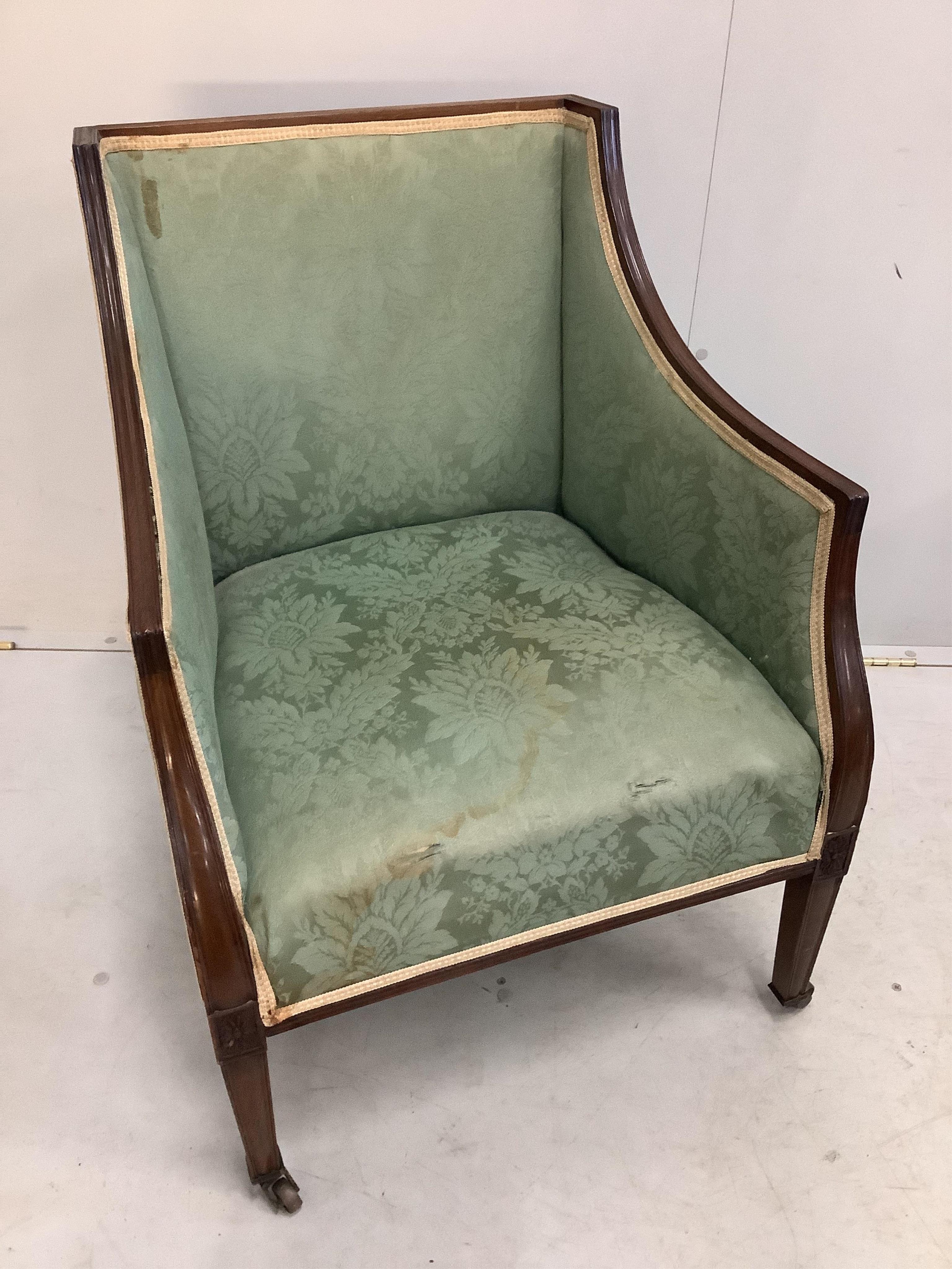 A pair of Edwardian mahogany armchairs, width 59cm, depth 55cm, height 79cm. Condition - fair, upholstery poor